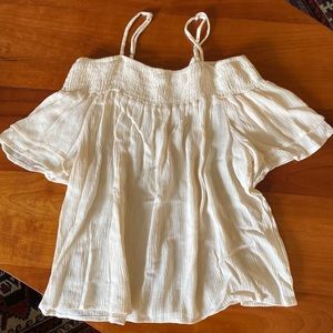 Shoulderless cream blouse